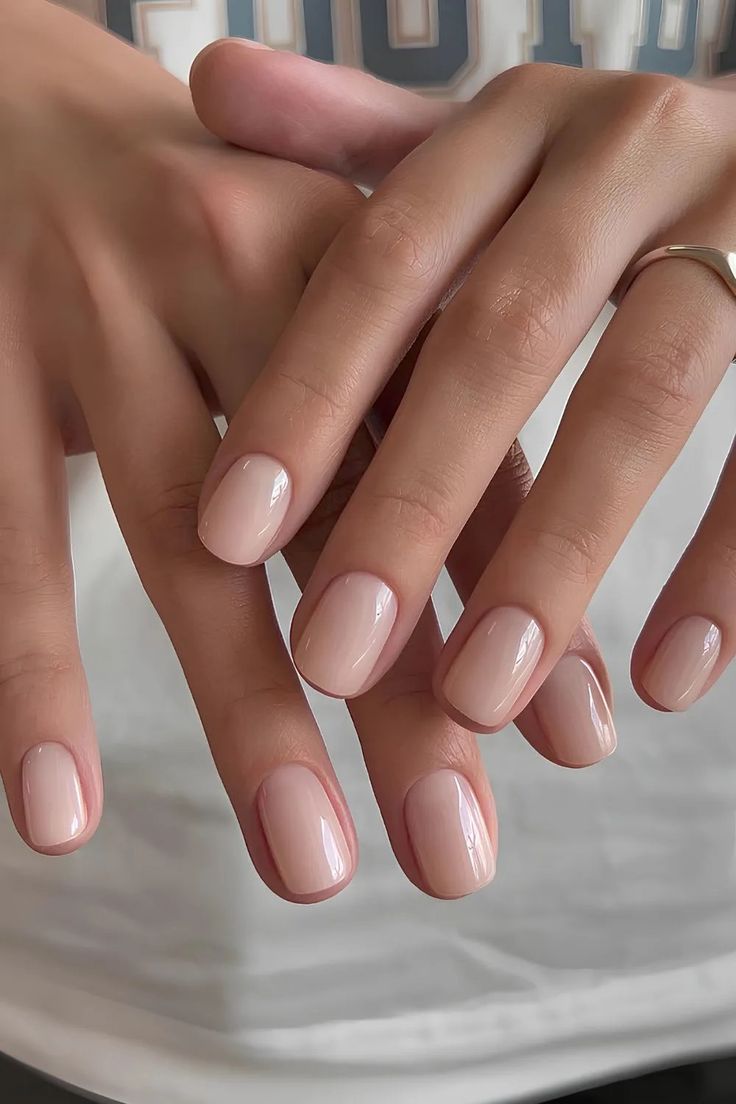 Manicure of peach creams white milk nails with pearls