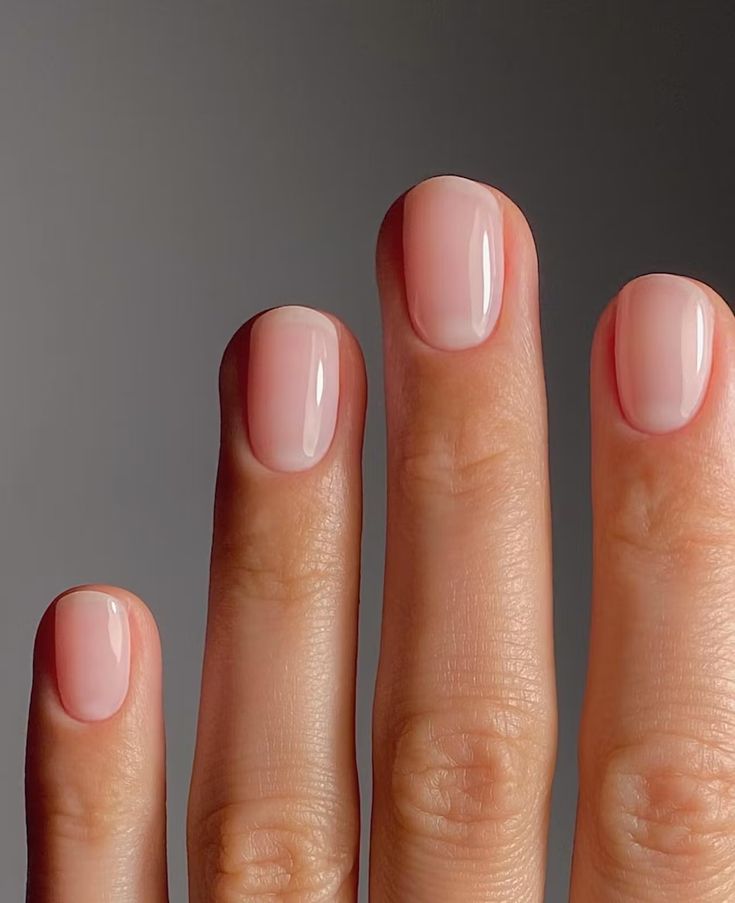 Manicure of peach creams white milk nails with pearls