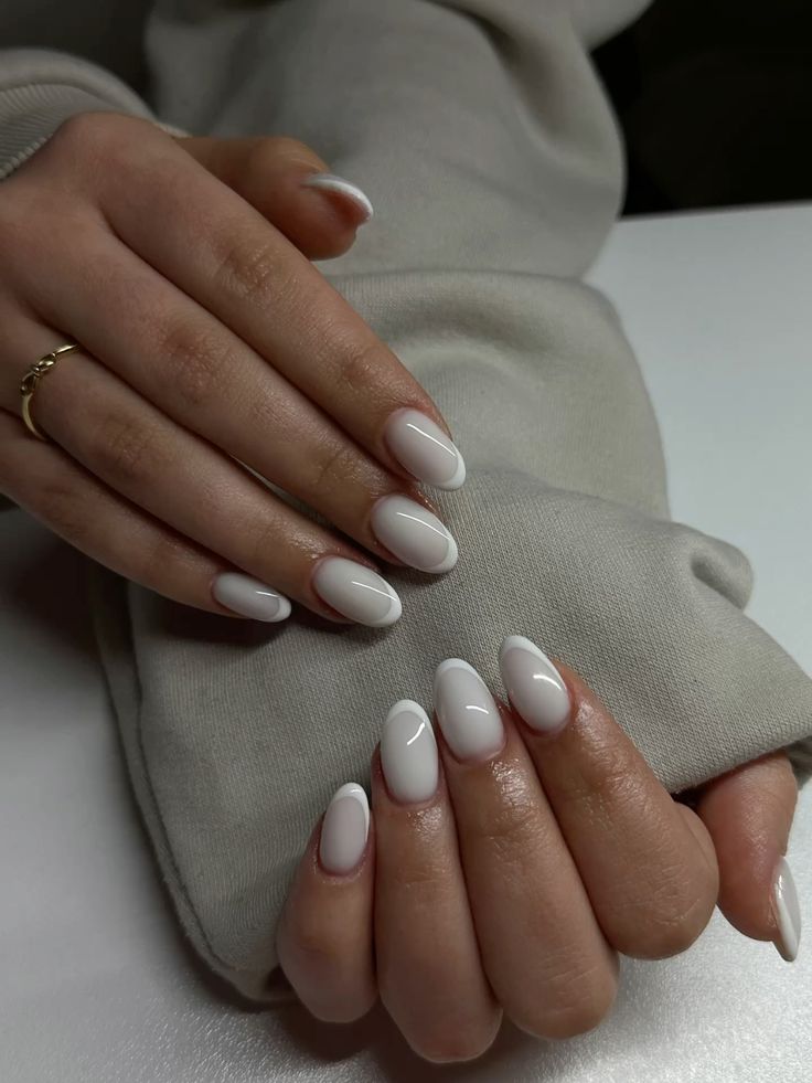 Icy white French manicure on almond nails