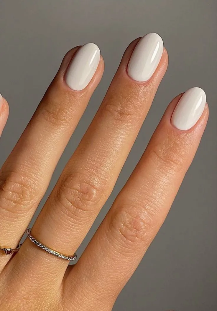 Short white nails glossy oval surface treatment