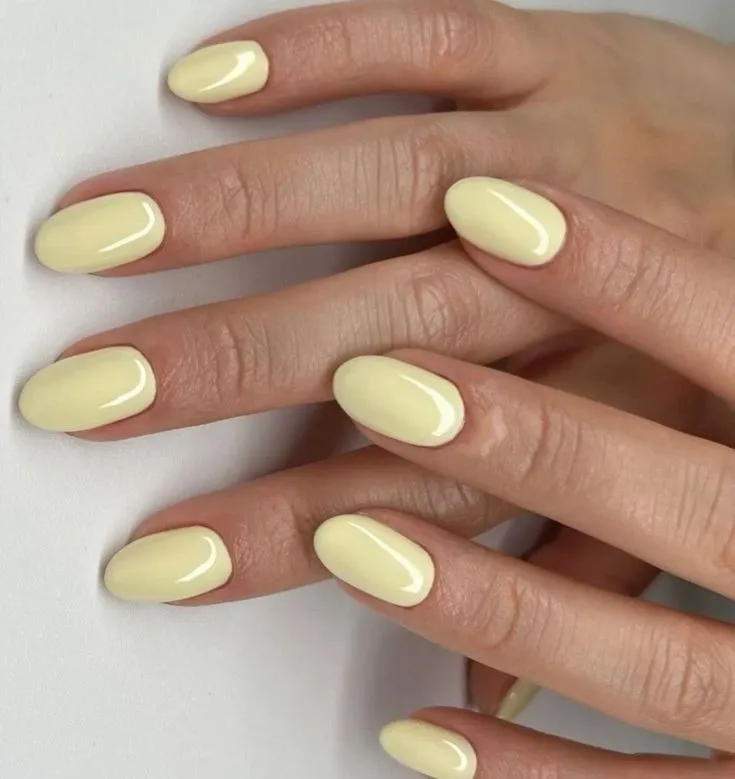Short almond butter yellow shiny nails