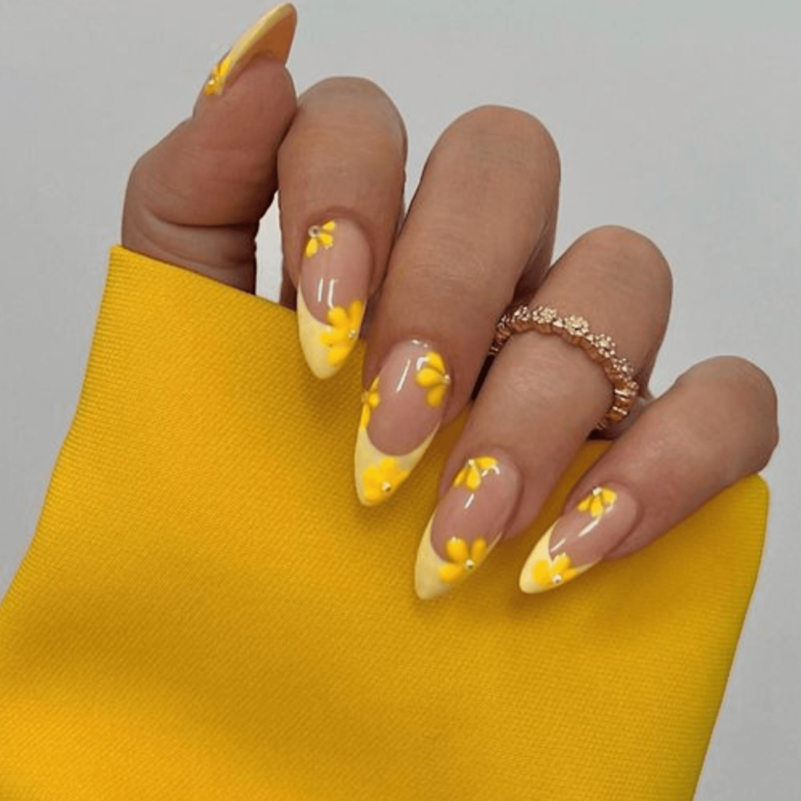 Yellow floral nails with gem