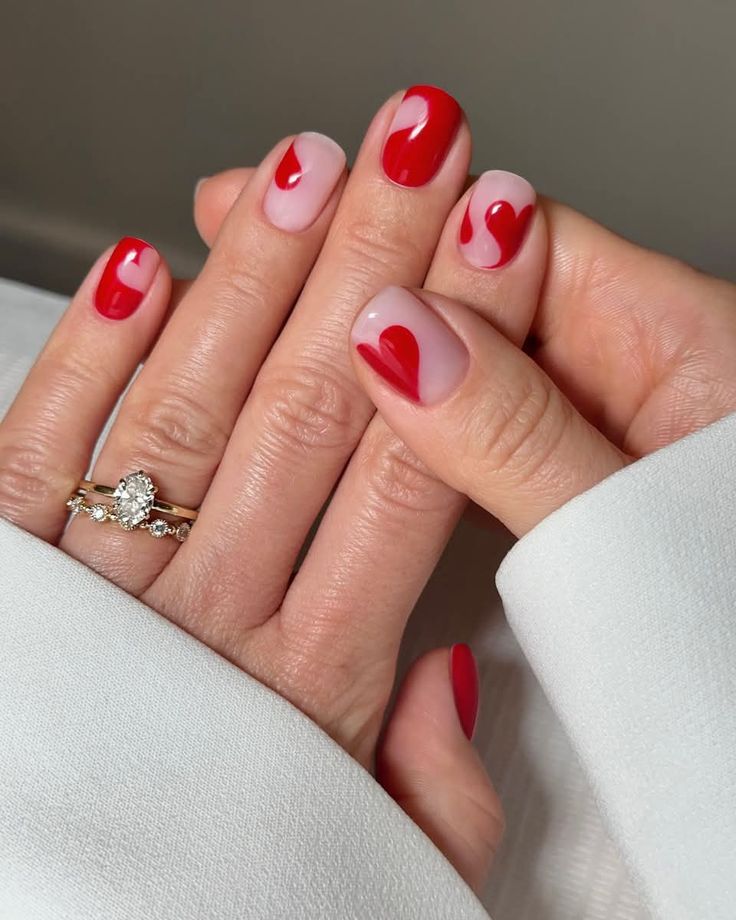 Red heart nail with swirling short nail design