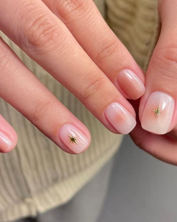 Golden Star Detail on Peach Aura Nails