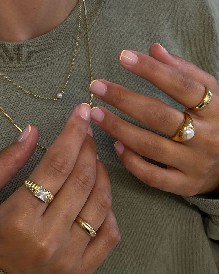 Micro French tip nails in a soft peach