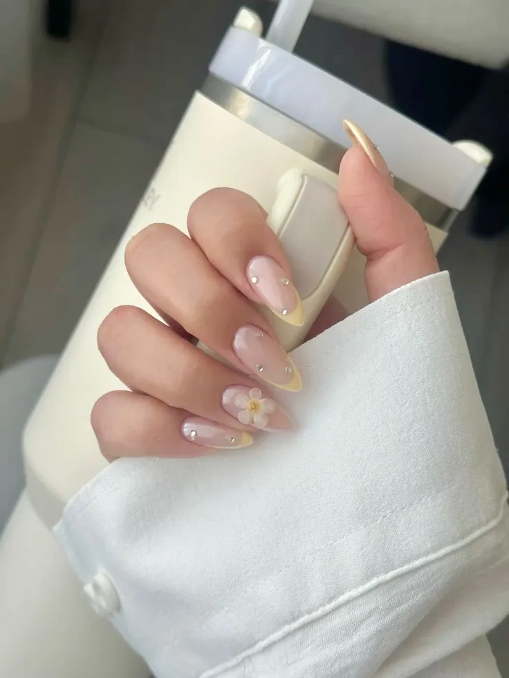 butter yellow French tip of nails with gems