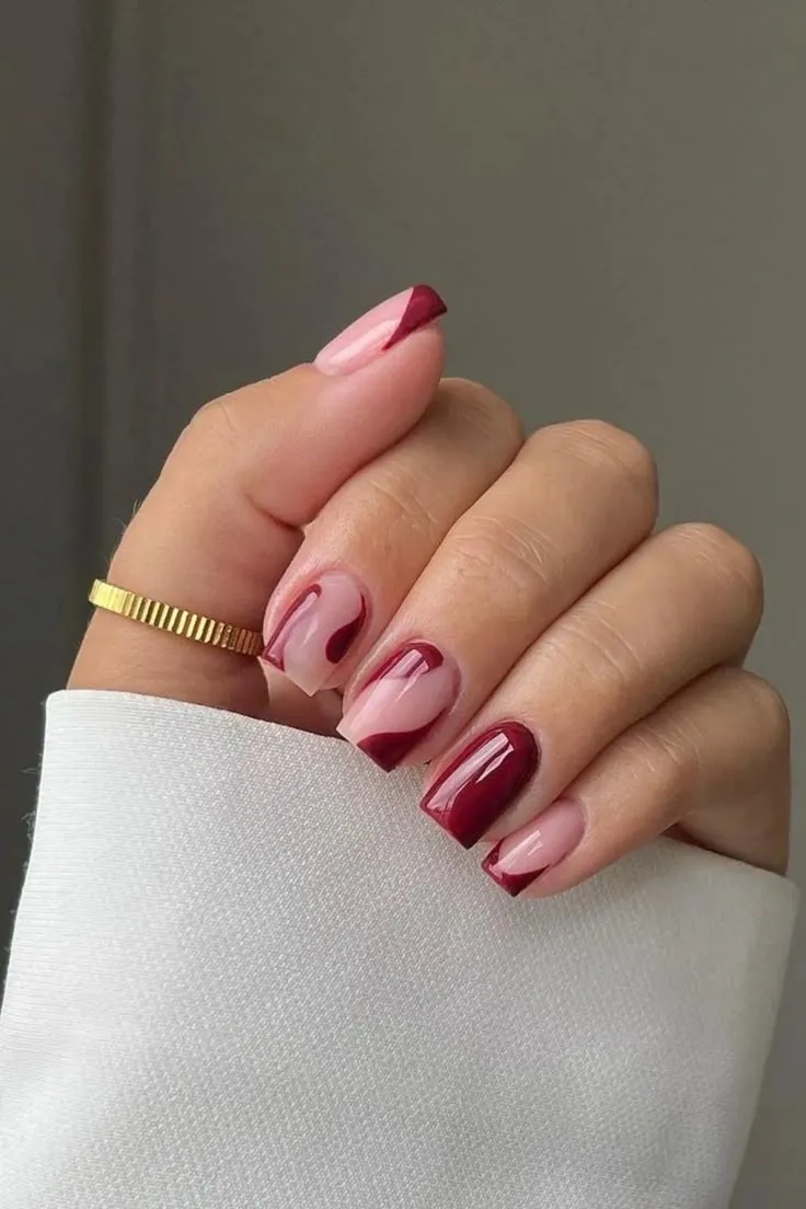 Pomegranate red nails with abstract shapes