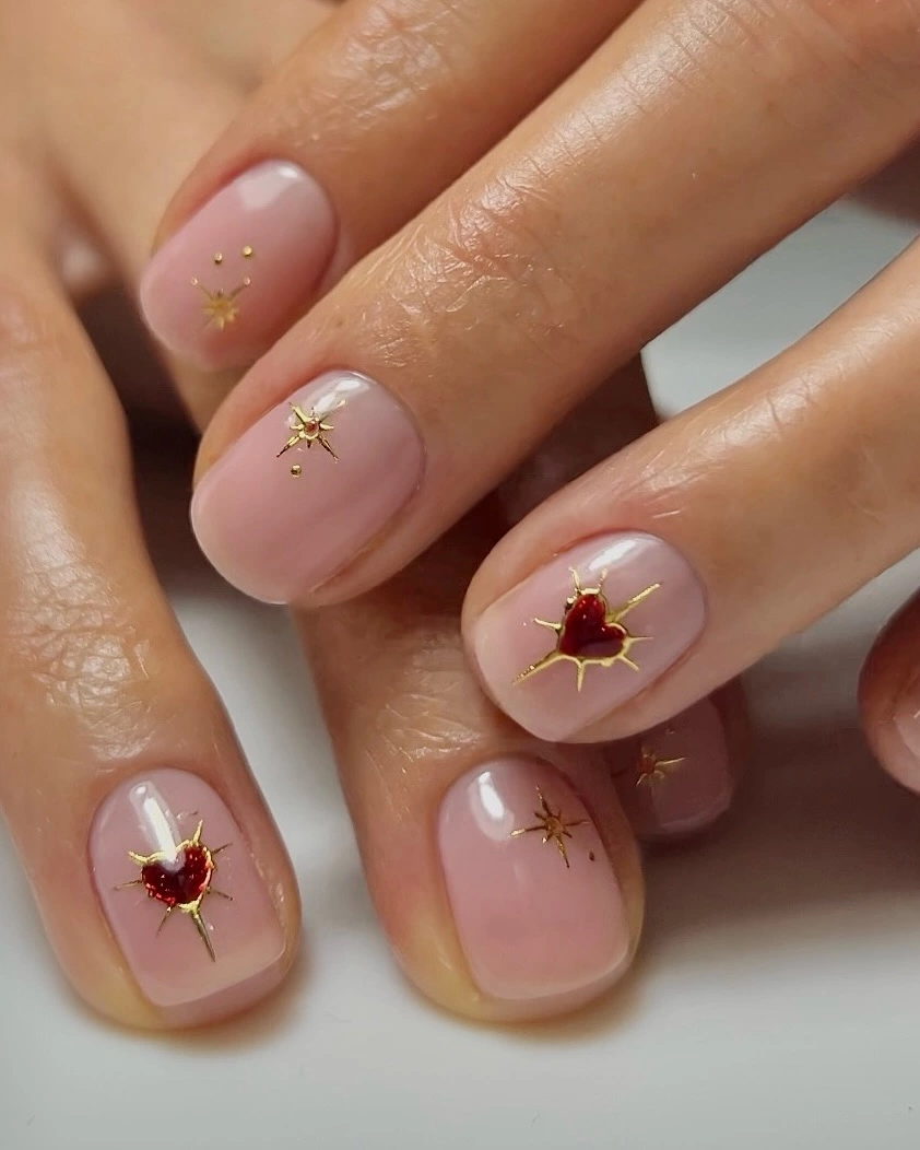 Short nails gold starfish and red gems starts seer nude base