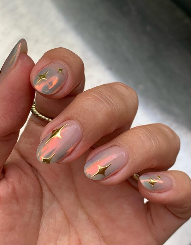 Iridescent nails with gold star