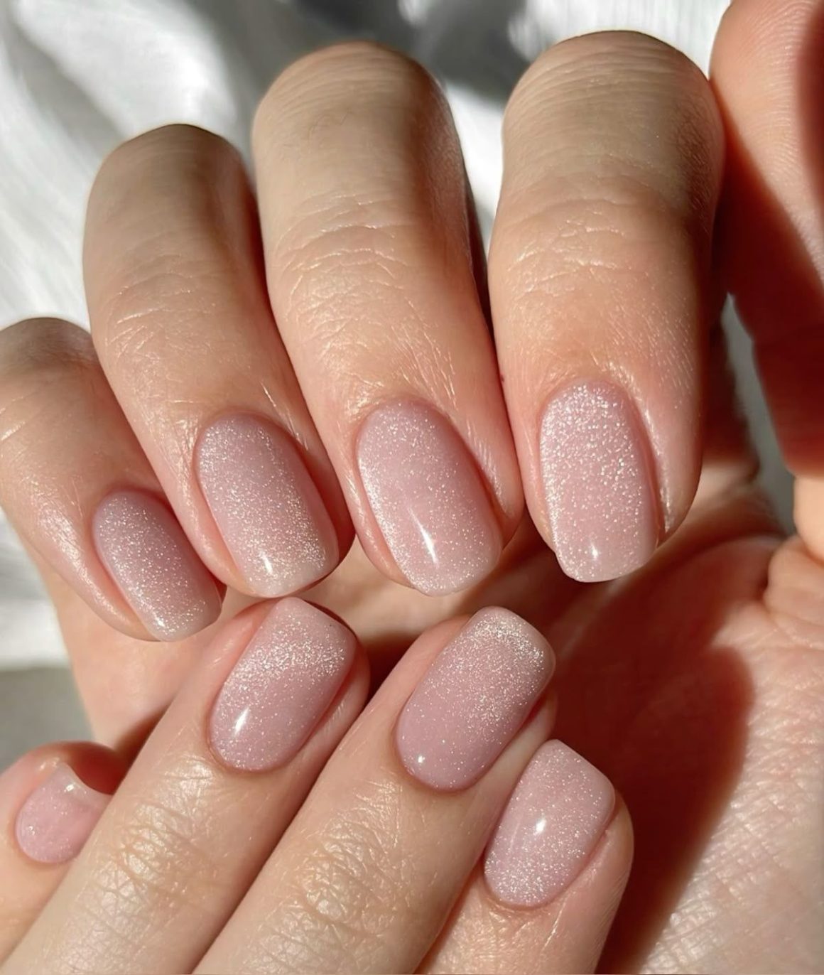 Light pink cat eye nails