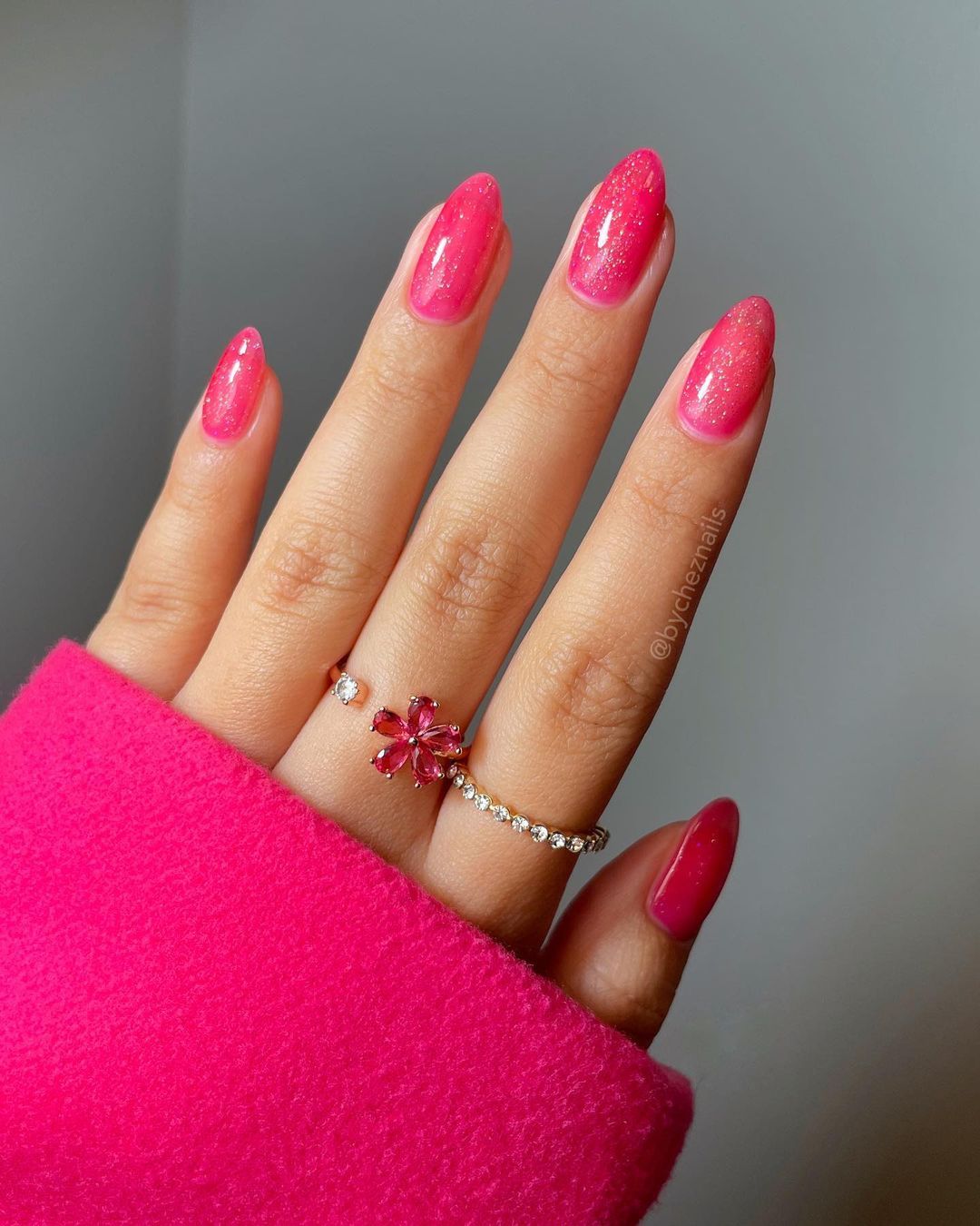 Hot pink cat eye nails almond design