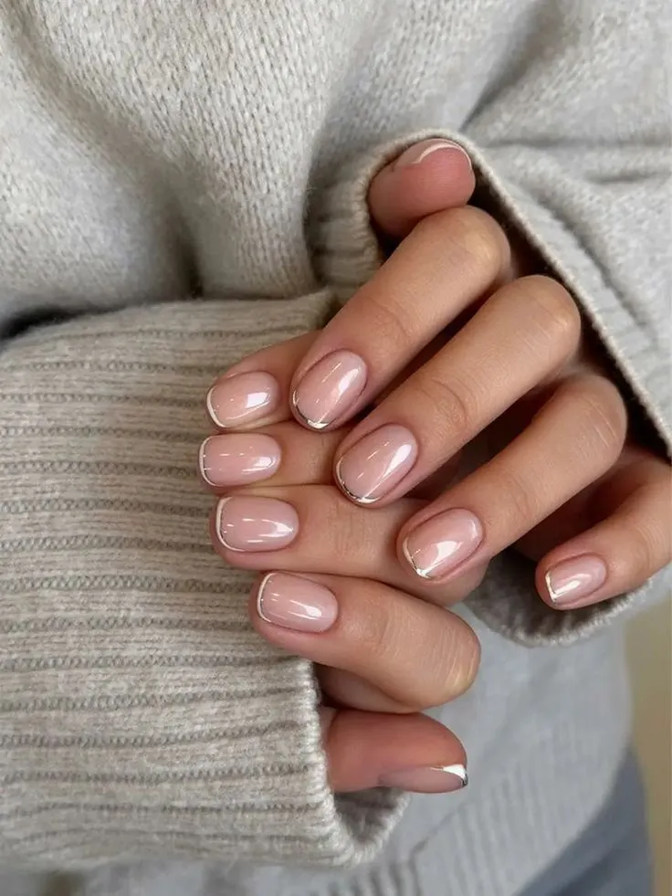 Skinny silver french tip nails on a square design