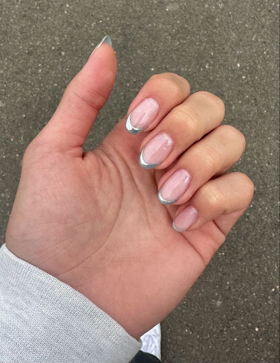 Skinny silver french tip nails on a square design