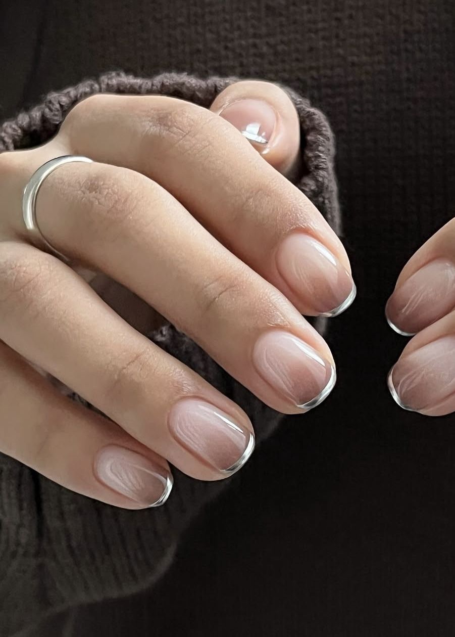 Skinny silver french tip nails on a square design