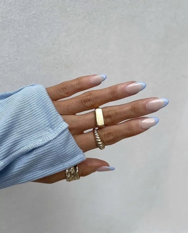 baby blue French nails on a milk base with a chrome finish