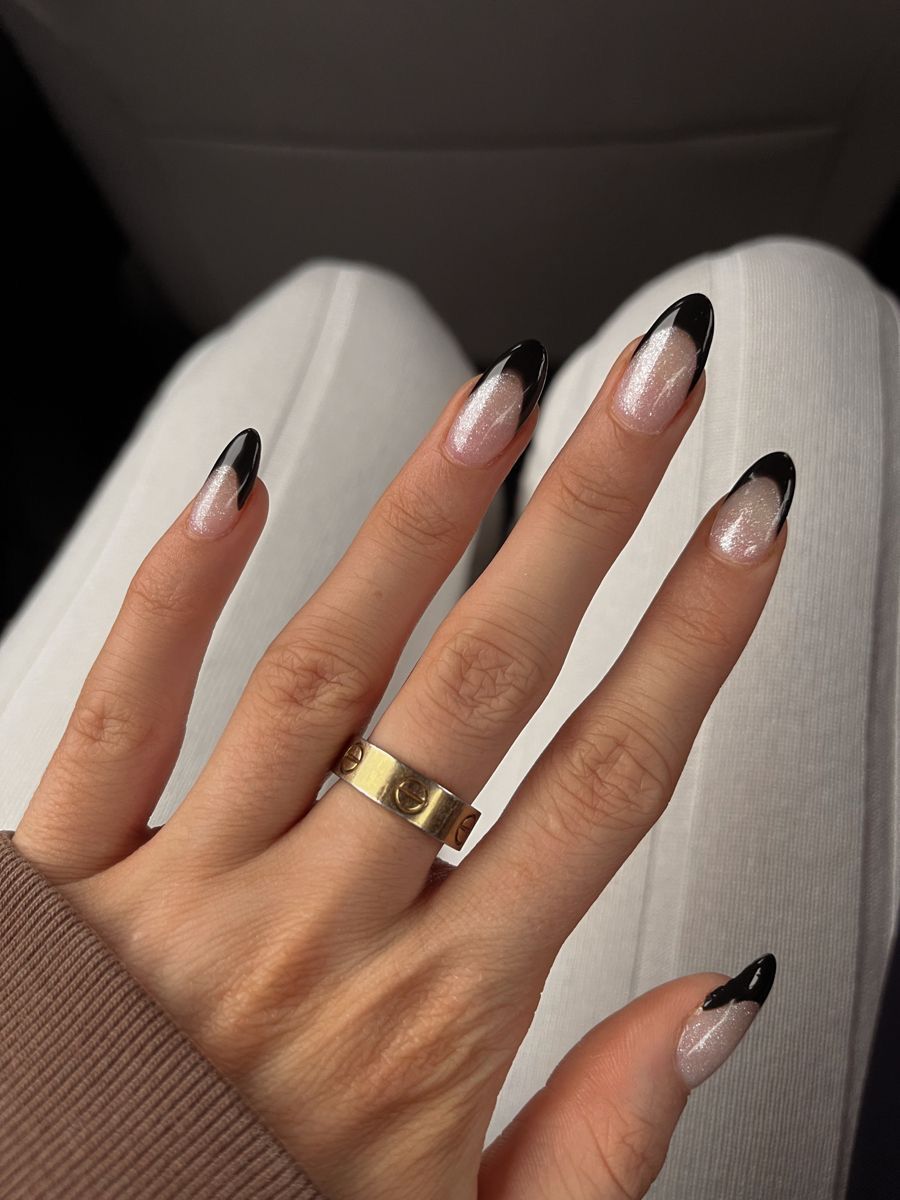 Black french nails with glitter base and chrome finish