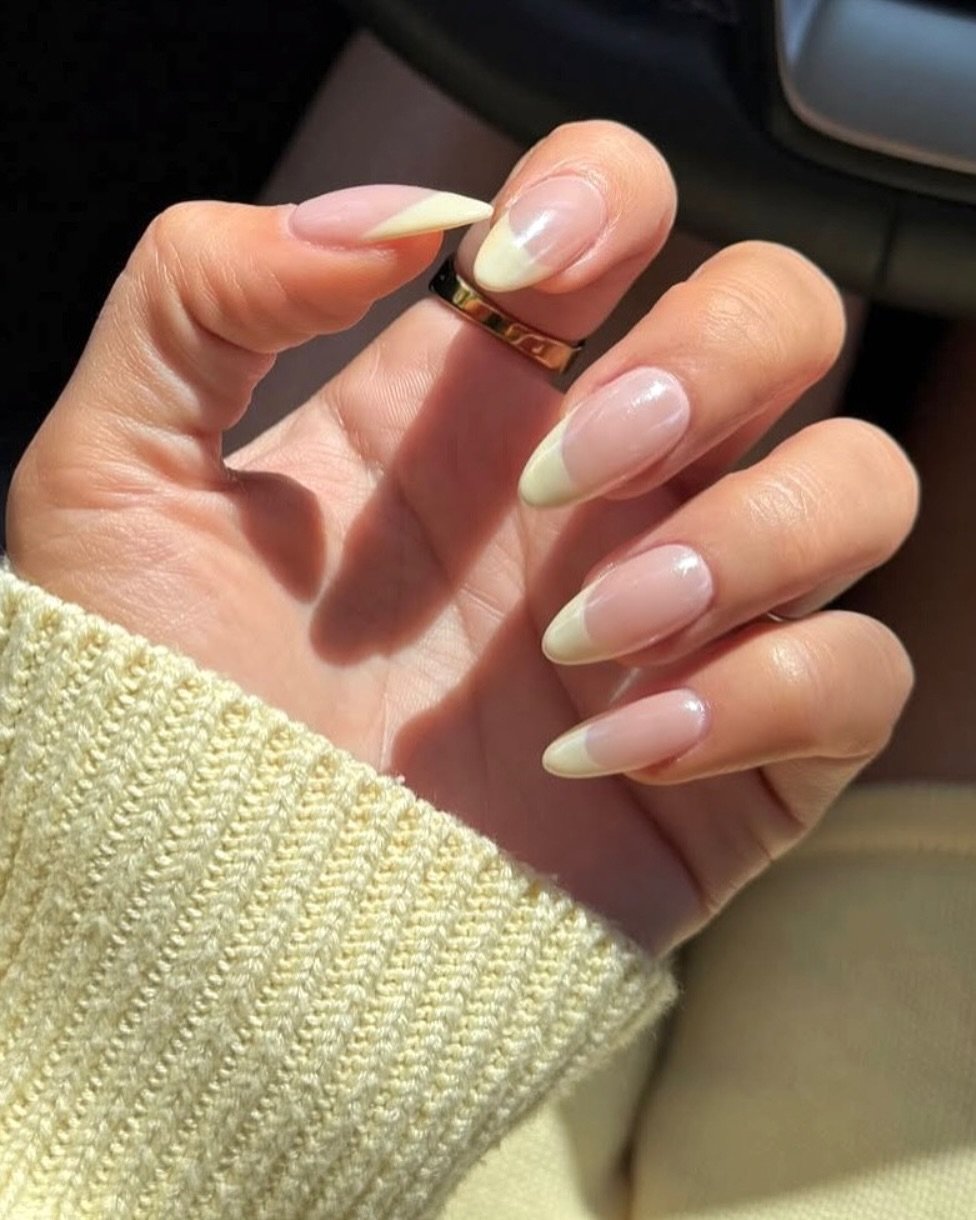 Yellow french nails with chrome finish