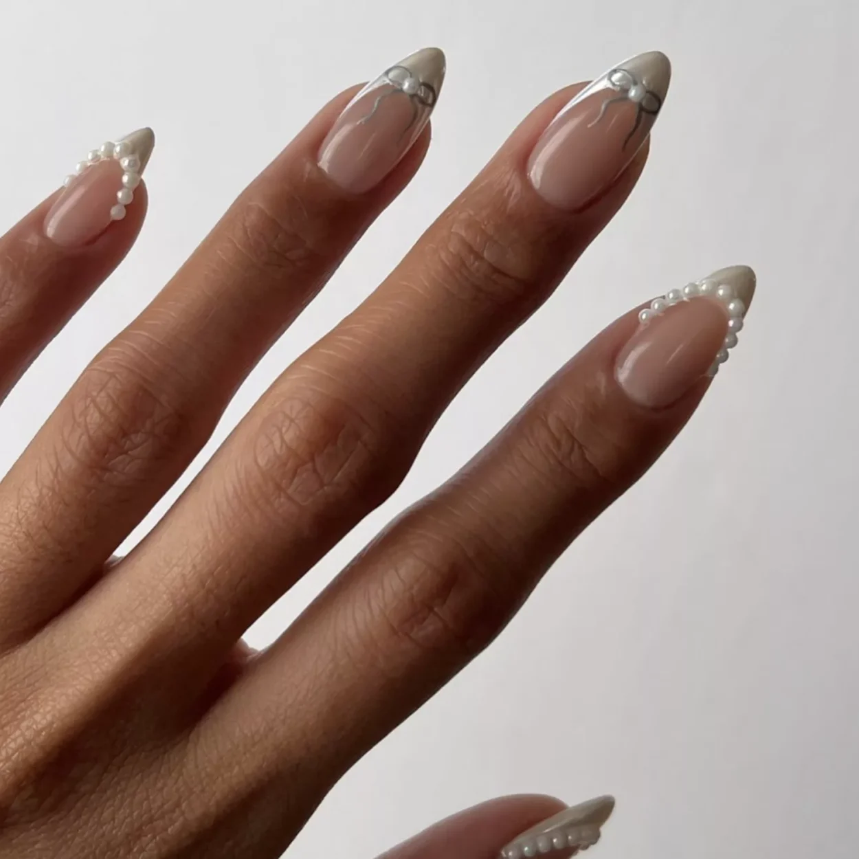 bridal chrome french nails with bows and pearls